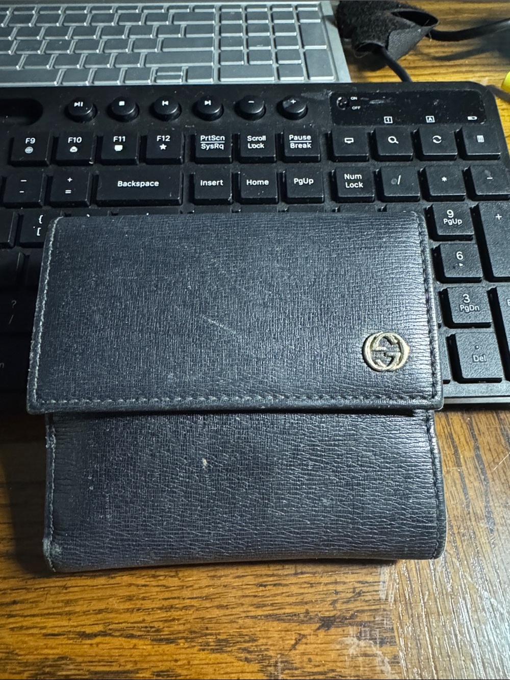 Gucci Black Leather Foldover Wallet with Gold Logo Accent